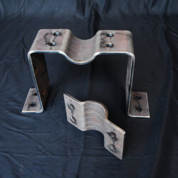 Two U-shaped steel brackets with pre-drilled bolt holes.