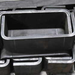 A stack of U-shaped steel channels.
